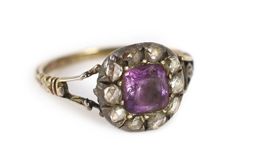 A Georgian gold, foil backed amethyst and rose cut diamond set cluster ring
